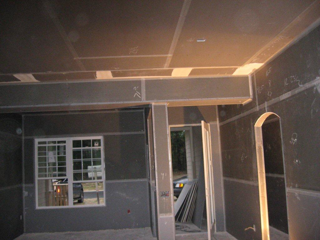 Drywall is installed, hiding the duct work.
