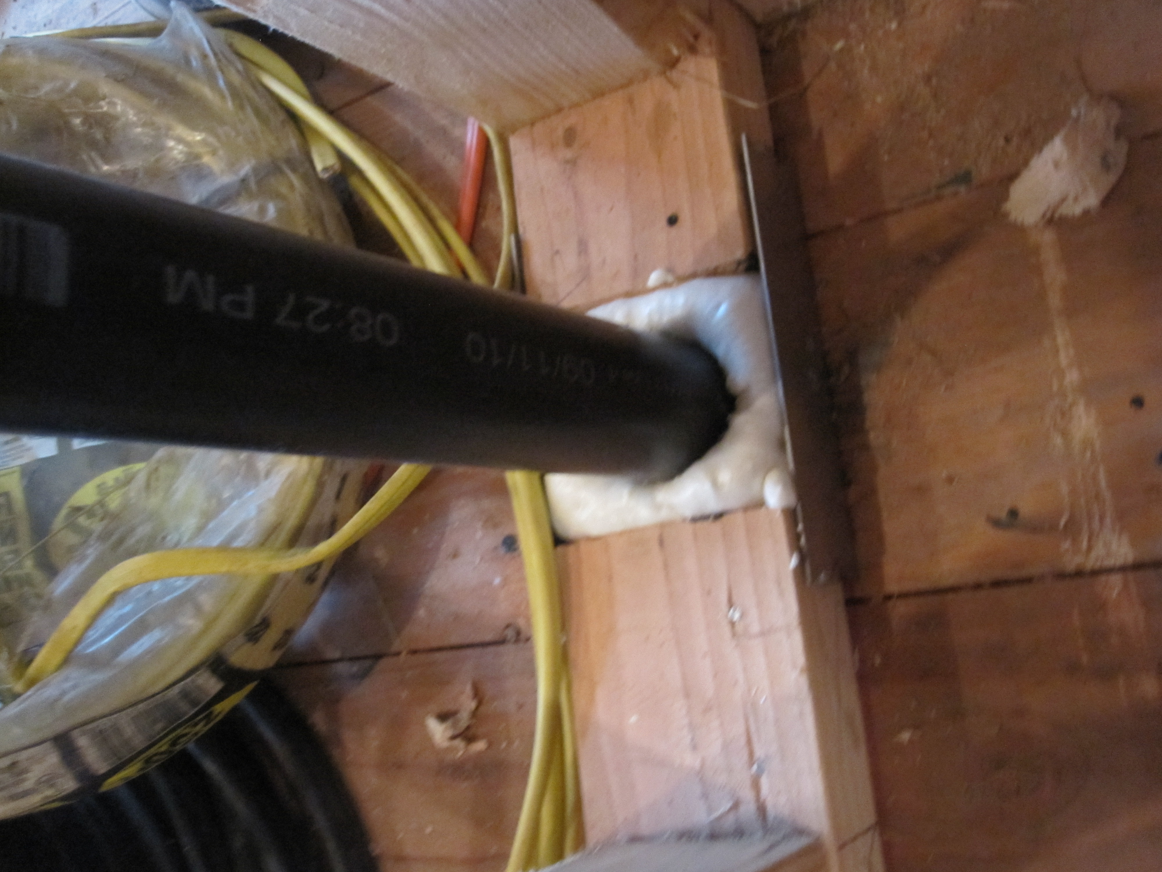 Foam holes for plumbing in the top plate, sill plate, or subfloor.