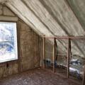 The unvented attic is insulated along the underside of the roof deck with 7 inches (R-49) of closed-cell spray foam, providing vaulted ceilings and a conditioned knee wall space for ducting.  