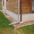 Right - A corrugated metal closure conceals the exterior rigid insulation at the slab edge