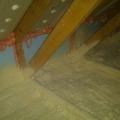 Closed-cell spray foam insulation covers the attic floor to provide a continuous air control layer.