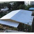 Right - This roof has a low gable and is secured to the wall framing to resist wind uplift.